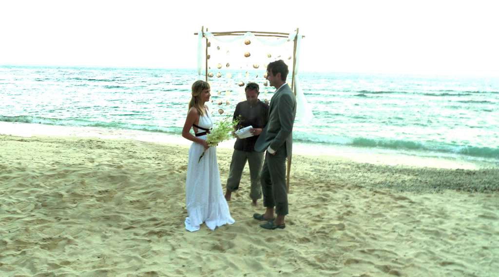 Two castaways getting married on a secluded beach